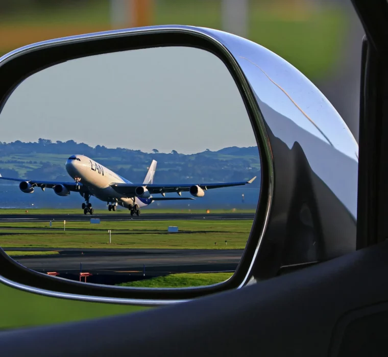 Aeroplane taking off - captured in the rear-view mirror, a symbol of departure, wanderlust and new perspectives.