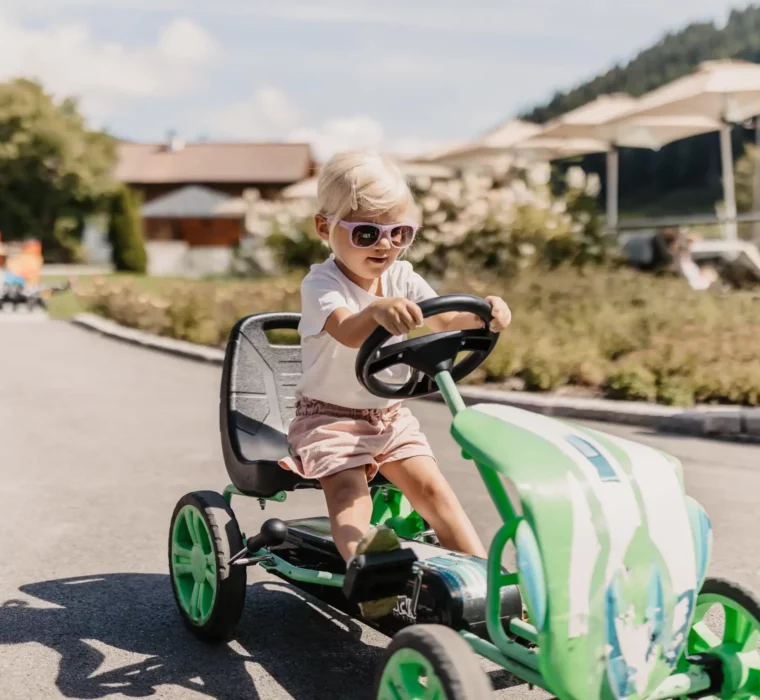 Hofgut-Wagrain-Apartment-Resort-Wagrain 454 Children ride go-karts and balance bikes through Hofgut Wagrain