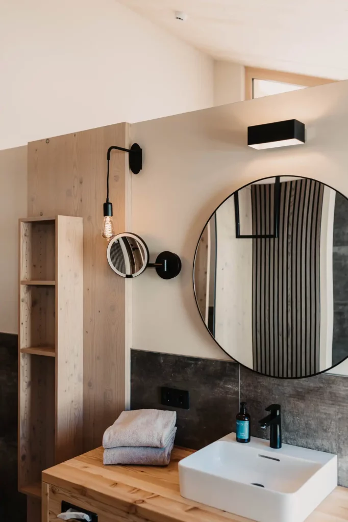 Hofgut-aparment-lifestyle-resort-wagrain-75 Elegance in detail - your stylish bathroom at Hofgut Wagrain with natural materials and modern accents.